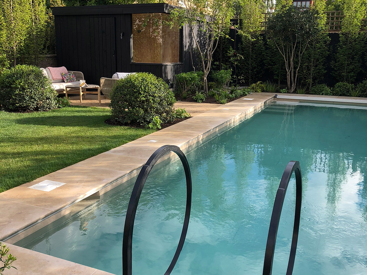 A garden focused around a central swimming pool designed by Studio Ikram
